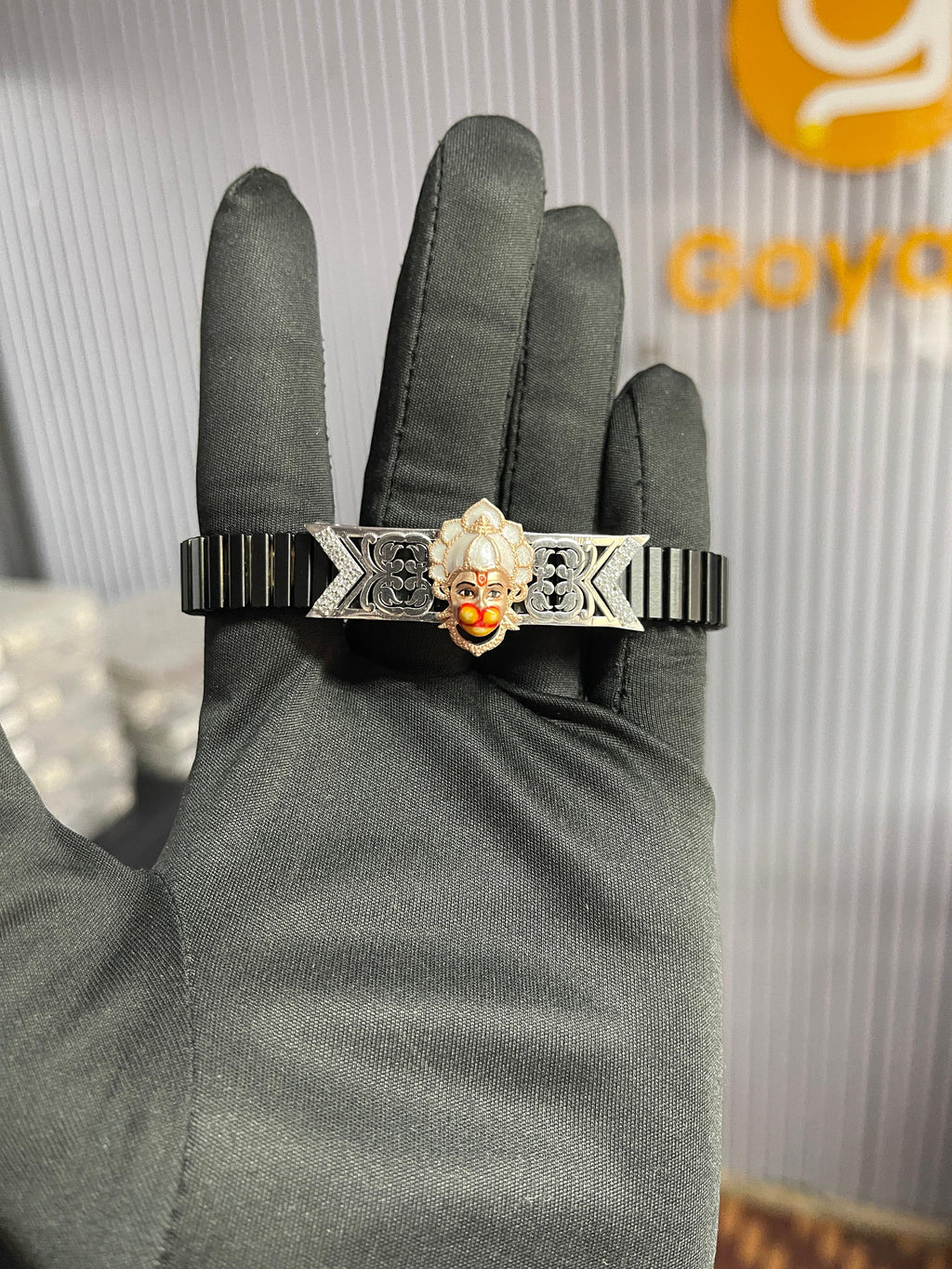Close-up detail of the Hanumanji pendant on the 925 silver bracelet, highlighting the vibrant hand-done enamel colors.