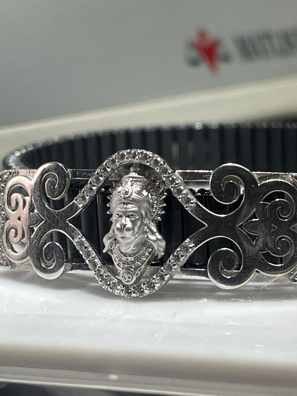 The complete 925 silver Hanumanji bracelet with Mina work laid flat to display its full length and design details.