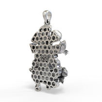 The Silver Narasimha Pendant worn with a chain to show its size and how it hangs for daily wear.