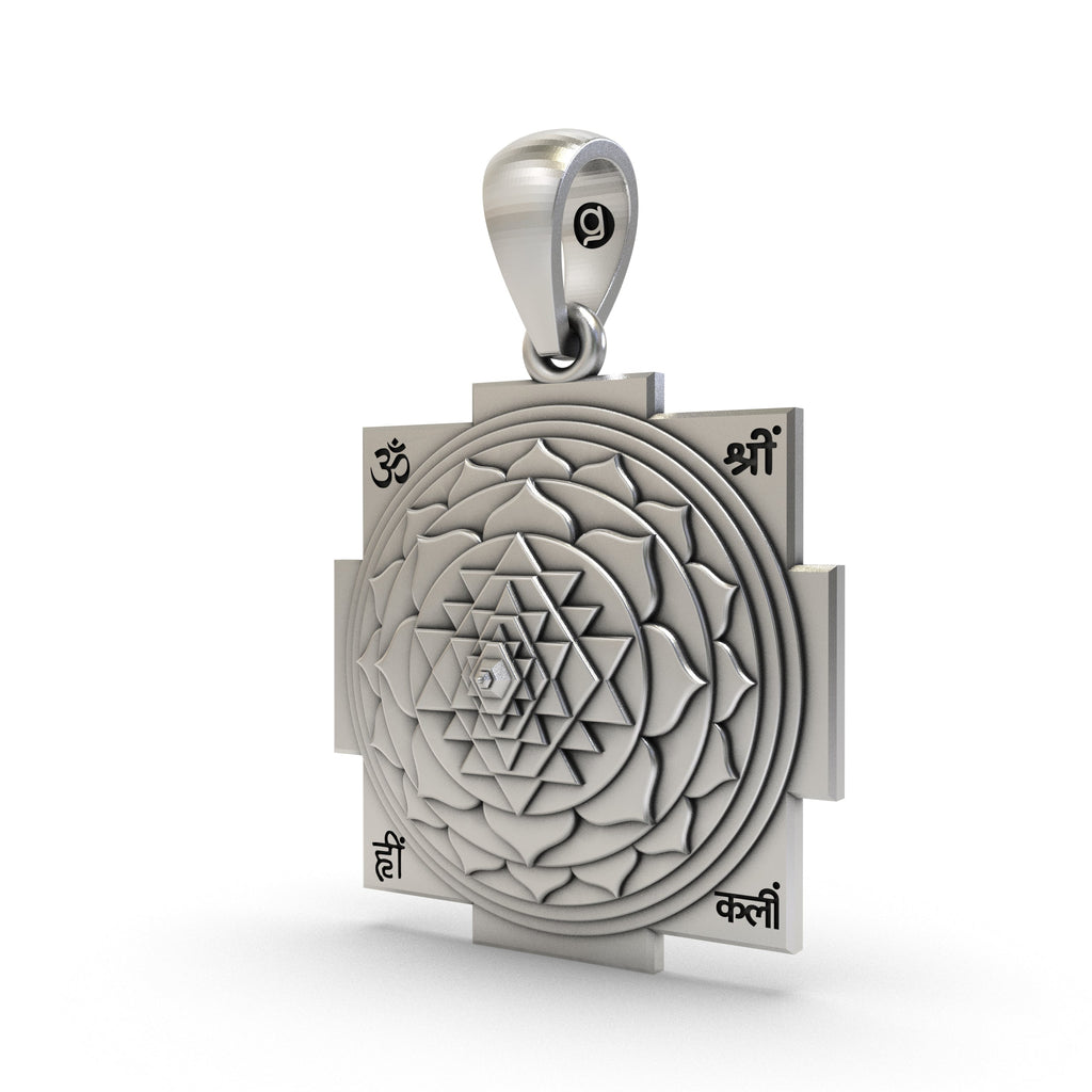 Close-up of the pure sterling silver Shri Yantra Amulet highlighting its high-polish finish.