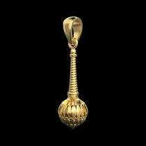 The spiritual 925 silver Gada pendant with 18K gold vermeil finish resting on a textured surface to show its true color.
