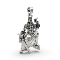 An angled view of the South Indian Sanggili Karuppar guardian deity amulet in 925 sterling silver.