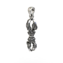Beautifully oxidized 925 silver Vajra Dorje pendant resting flat, perfect for meditation and daily wear.